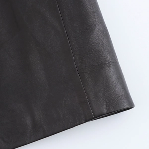 Close-up of black PU leather texture and premium stitching on loose jacket