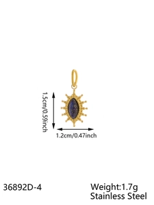 Macro view of gold sunburst pendant with blue gemstone inlay and dimension markings