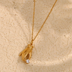 18K gold plated stainless steel necklace featuring a hand pendant with white zircon accent