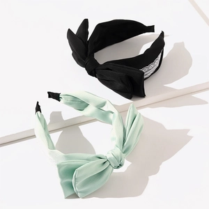Fashionable bow headband set in black lace and light green fabric for elegant women