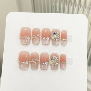 Luxurious handmade press-on nails with pink ombre, silver glitter and floral rhinestone accents