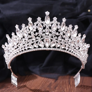 Close-up of bridal crown featuring pear-cut rhinestones and silver metal hair combs