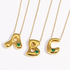 Gold-plated 18k titanium steel bubble letter necklaces with green heart gemstones