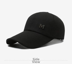 Detailed side view of black cotton baseball cap with silver metal M logo ornament