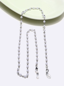 Detail of white faux pearl eyewear chain with anti-slip silicone loops and silver metal