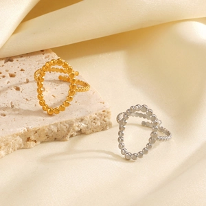 Anello geometrico ovale in acciaio inossidabile con design a perline in oro 18 carati