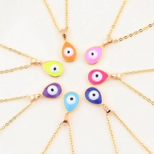 Seven colorful enamel evil eye teardrop necklaces with gold-plated chains on white background