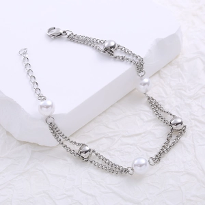 Elegant 18k gold plated double-layer pearl bracelet with adjustable chain and silver finish