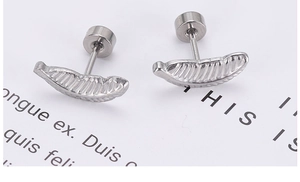Detail shot of stainless steel curved stud earrings with secure screw-back closures