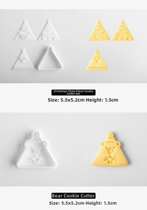 Detail of Christmas tree and bear cookie cutters with 3D pressed biscuit samples