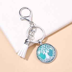 Elegant Tree of Life glass pendant keychain with silver ring and white tassel accessory