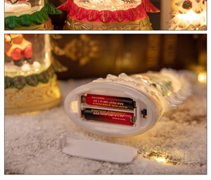 Close-up of the battery compartment and power switch on the base of the Christmas snow globe
