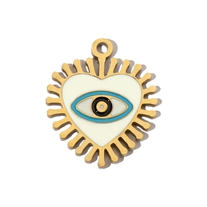 Detail of a golden heart enamel pendant featuring a blue and white evil eye design