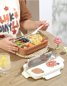 Detailed view of 3-compartment stainless steel bento box with phone holder lid