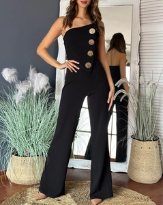 Detail of slim-fit black strapless jumpsuit featuring four decorative gold embossed buttons