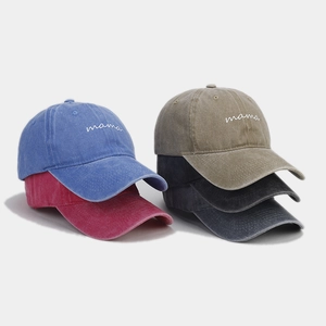 Detail view of colorful vintage washed cotton baseball caps with mama embroidery