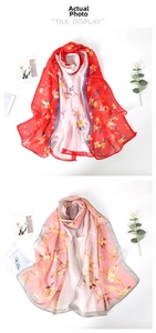 Detailed view of floral printed chiffon scarves in red and pink with sheer texture