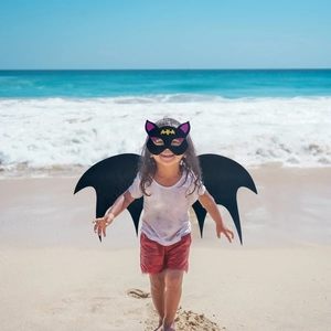 Detailed view of children's black felt bat wings and mask set for Halloween parties