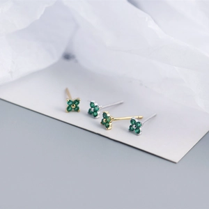 Minimalist S925 silver four-leaf flower stud earrings with green zircon in gold and silver
