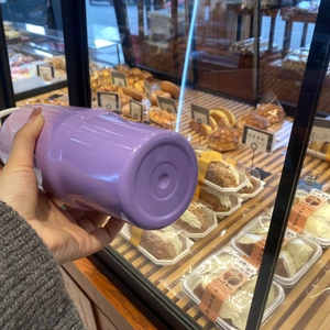 Macro detail of a 30oz lavender gradient stainless steel tumbler with polished finish