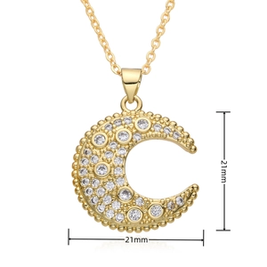 Detail of 21mm gold crescent moon pendant with micro-pave cubic zirconia inlay