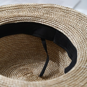 Flat top straw sun hat with pearl accents featuring internal adjustable sweatband