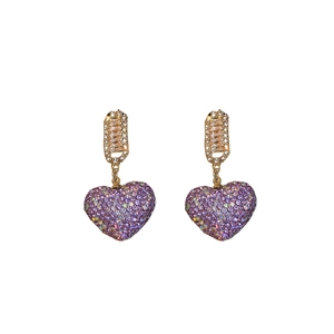 Elegant gold drop earrings with sparkling purple heart shaped zircon stones on white background