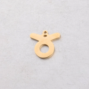 Detailed view of 15mm gold Taurus zodiac charm in polished mirror stainless steel finish
