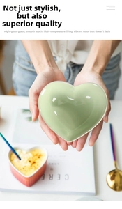 Close-up of heart-shaped mint green ceramic bowl with a glossy glazed finish