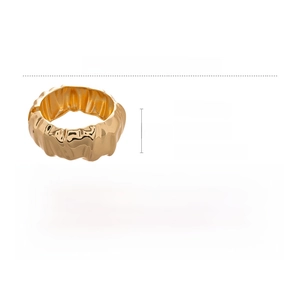 Detailed view of wide gold alloy cuff bracelet with textured finish and 7.8cm diameter