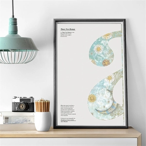 Close-up of minimalist black framed Times New Roman typography art print on a wooden table