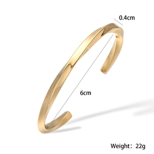 Detail shot of 18K gold plated minimalist twisted cuff bracelet with 4mm width size info