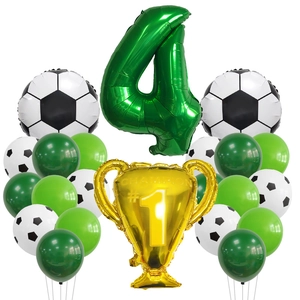 Detail of football party kit featuring number 4 balloon and gold champion trophy