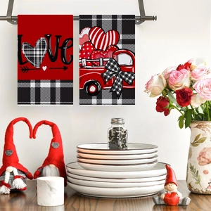 Valentine's Day red truck and LOVE print kitchen towels set hanging in a warm home kitchen