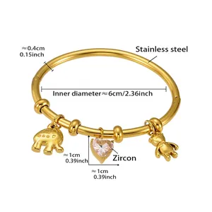Detail showing dimensions of 18k gold plated stainless steel bangle with cute charms