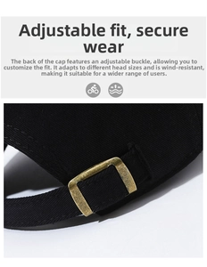 Detail of adjustable brass buckle on black cotton baseball cap for a custom fit