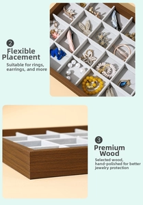 Detail view of walnut grain jewelry tray with gray velvet dividers for rings and earrings