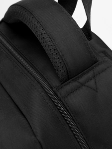 Minimalist black laptop backpack with breathable mesh handle and durable metal zippers