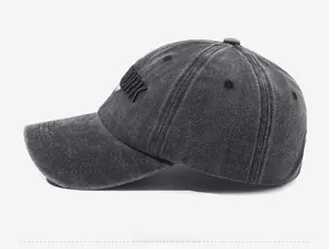 Detailed side view of washed cotton vintage baseball cap with red and black embroidery