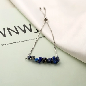 Detail of adjustable stainless steel bracelet with blue and gray raw crystal chips