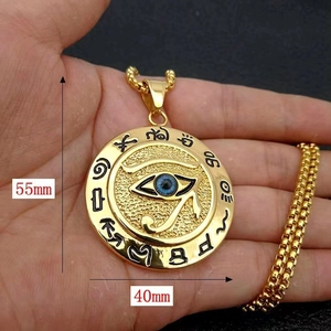 Detailed view of golden Eye of Horus pendant measuring 55mm by 40mm with blue eye inlay