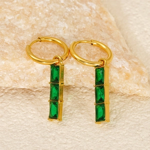 Elegant gold bamboo style earrings featuring vertical emerald green zircon crystals