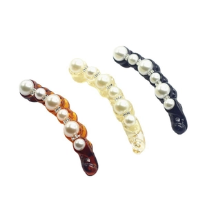 Banana hair clips with leopard print, pearls and rhinestones in amber, beige, and black