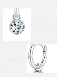 Detail of 2ct Moissanite earrings showing 925 silver hallmark and 3EX cut stone brilliance
