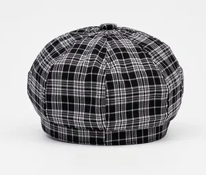 Rear view of plaid octagonal newsboy hat showing stitched panels and top button