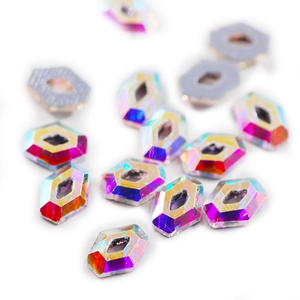 Macro view of iridescent hexagon flatback crystals with multi-faceted Aurora Borealis shine