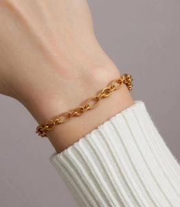 Detailed close-up of 18k gold-plated 304 stainless steel chunky link bracelet on wrist