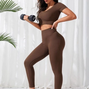 Women's deep brown seamless ribbed yoga set with v-neck crop top and high waist leggings