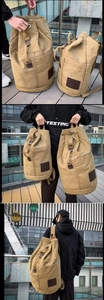 Detailed views of khaki canvas bucket backpack with leather trim for travel and outdoor