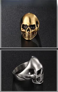 Detail of skull ring with black enamel accents in gold and silver finish on textured base